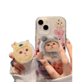 Phone case with cute animal design held by a person